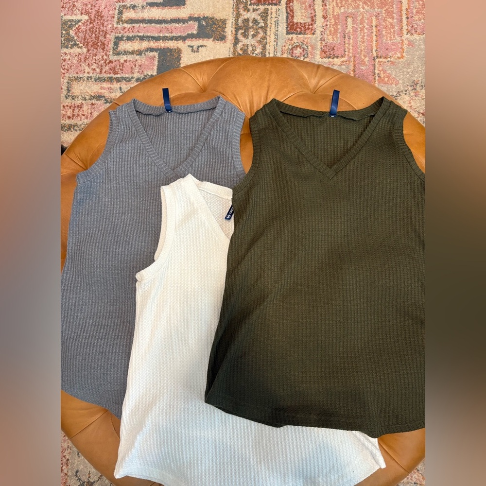 Bundle of three loose fit tanks.